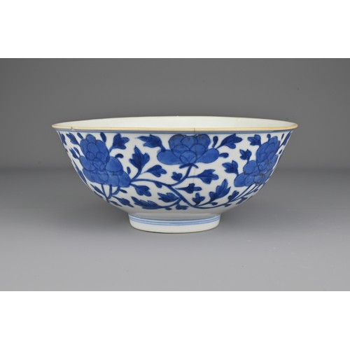 7 - A Chinese early 19th Century blue and white porcelain bowl. The exterior decorated with scrolling pe... 