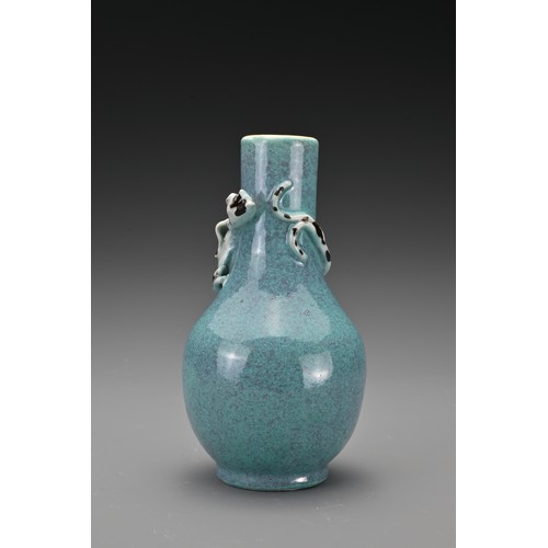 57 - A Chinese 19th Century 'robin's egg'-glazed porcelain bottle vase with a moulded chilong around the ... 