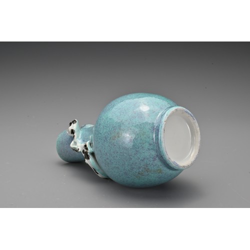 57 - A Chinese 19th Century 'robin's egg'-glazed porcelain bottle vase with a moulded chilong around the ... 