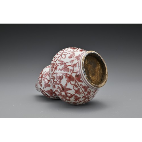 60 - A Chinese 20th Century underglaze-red vase in the form of a double gourd, decorated with floral spra... 