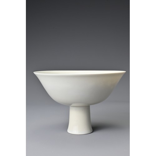 55 - A Chinese 18th Century white-glazed porcelain stem bowl. The bowl decorated in anhua to the interior... 