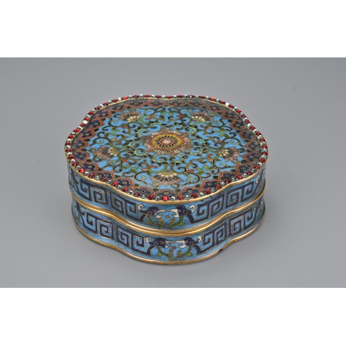 68 - A Chinese 18th Century lobbed cloisonné box and cover. The foliate-shaped box and cover decorated to... 