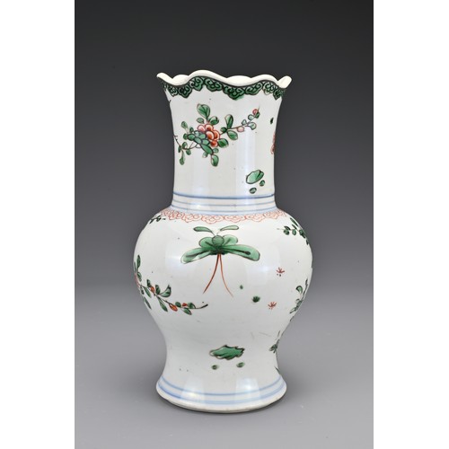 28 - A Chinese 18th Century wucai porcelain vase. The body with a lobbed rim decorated in a floral design... 