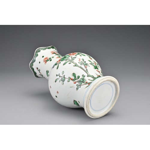 28 - A Chinese 18th Century wucai porcelain vase. The body with a lobbed rim decorated in a floral design... 