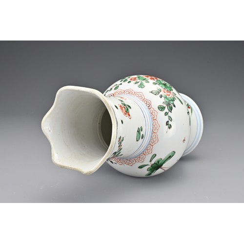 28 - A Chinese 18th Century wucai porcelain vase. The body with a lobbed rim decorated in a floral design... 