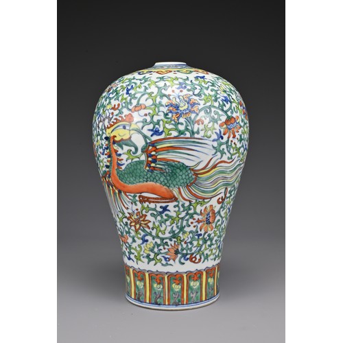 18 - A Chinese 19th Century doucai porcelain vase. The meiping shaped vase decorated with dragon and phoe... 