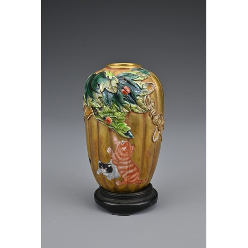 31 - A Chinese 19/20th Century ribbed porcelain pot. The pot with decorated with cats with raised decorat... 