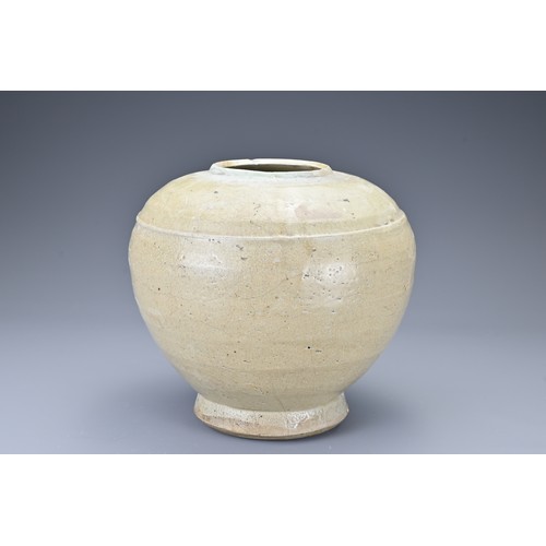 37 - A Southeast Asian stoneware ceramic jar. The globular jar on slightly splayed foot covered in a pale... 