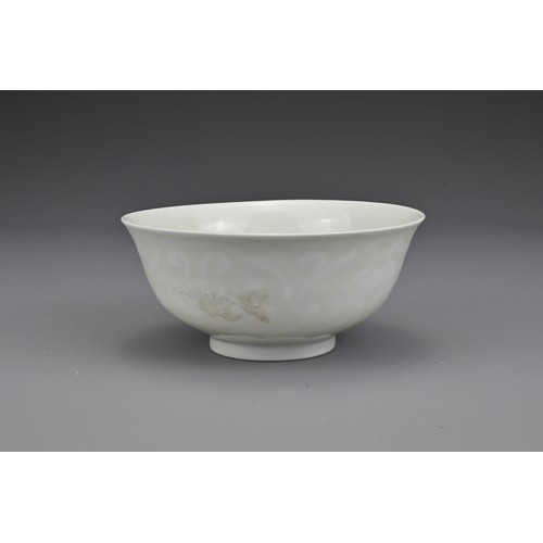 52 - A Chinese white-glazed porcelain bowl with moulded lingzhi fungus decoration. The base with undergla... 