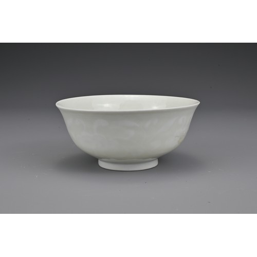 52 - A Chinese white-glazed porcelain bowl with moulded lingzhi fungus decoration. The base with undergla... 