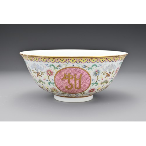 56 - A Chinese famille rose porcelain medallion bowl. The bowl decorated in polychrome enamels with round... 