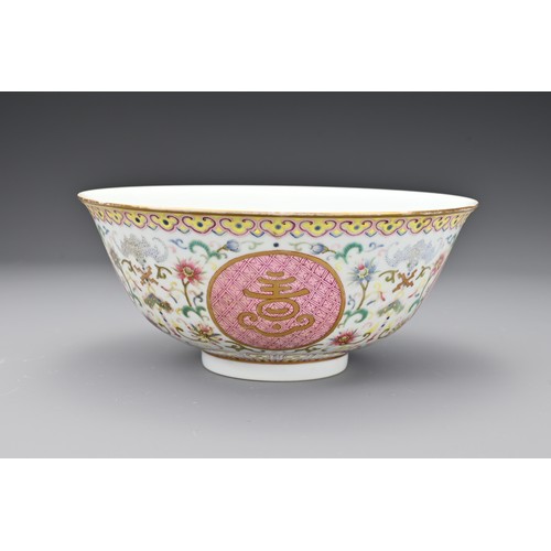 56 - A Chinese famille rose porcelain medallion bowl. The bowl decorated in polychrome enamels with round... 