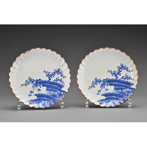 62 - A pair of Japanese Kakiemon blue and white lobbed porcelain dishes. Each dish decorated in underglaz... 