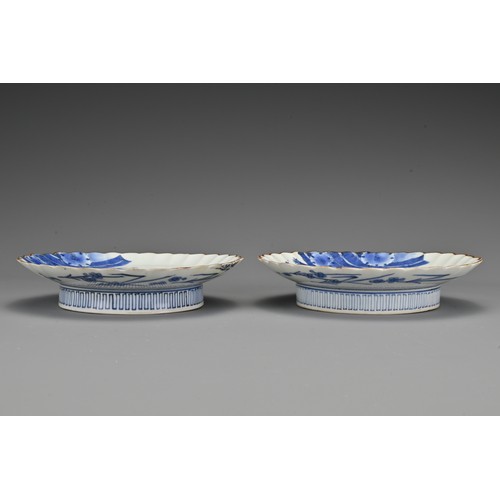 62 - A pair of Japanese Kakiemon blue and white lobbed porcelain dishes. Each dish decorated in underglaz... 