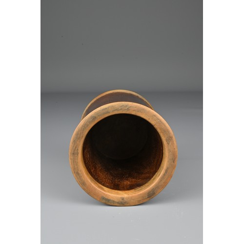 64 - A Chinese Huanghuali wood brush pot with added hardwood rim and base. Height 10.5cm. Diam. 9cm