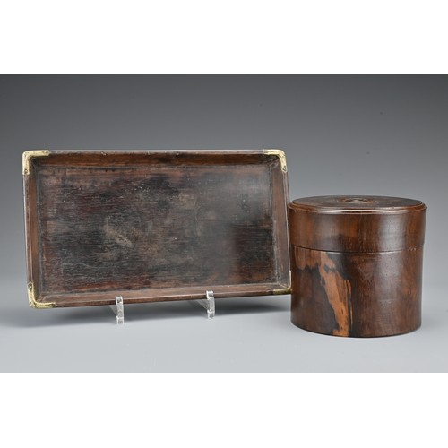 73 - A Chinese hardwood cylindrical box and cover together with a hardwood tray on four feet with metal f... 