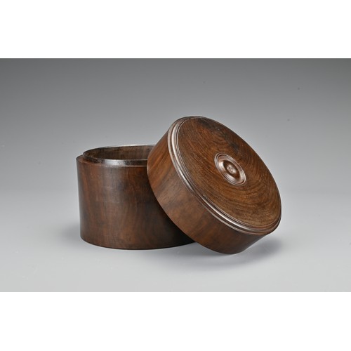 73 - A Chinese hardwood cylindrical box and cover together with a hardwood tray on four feet with metal f... 