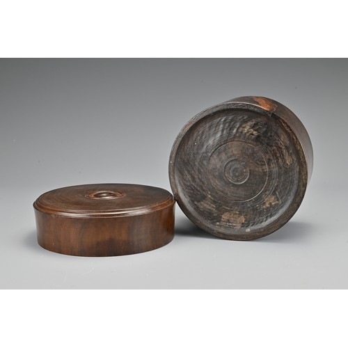 73 - A Chinese hardwood cylindrical box and cover together with a hardwood tray on four feet with metal f... 