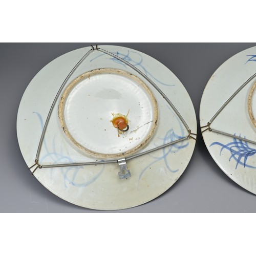 79 - A pair of Chinese 19th century blue and white porcelain dishes. Each decorated with flowering prunus... 