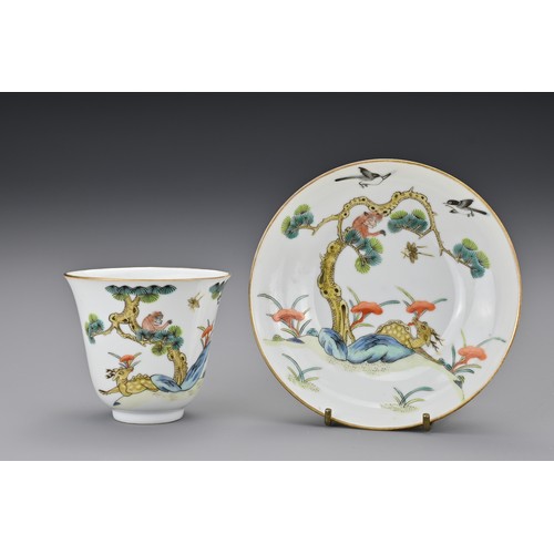 80 - A Chinese porcelain enamelled cup and saucer. Painted with a monkey in a pine tree with deer holding... 