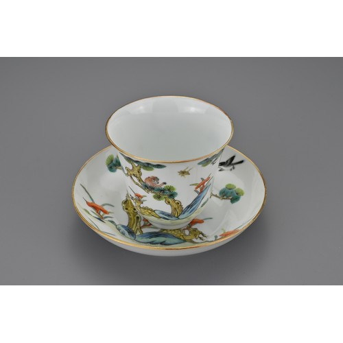 80 - A Chinese porcelain enamelled cup and saucer. Painted with a monkey in a pine tree with deer holding... 