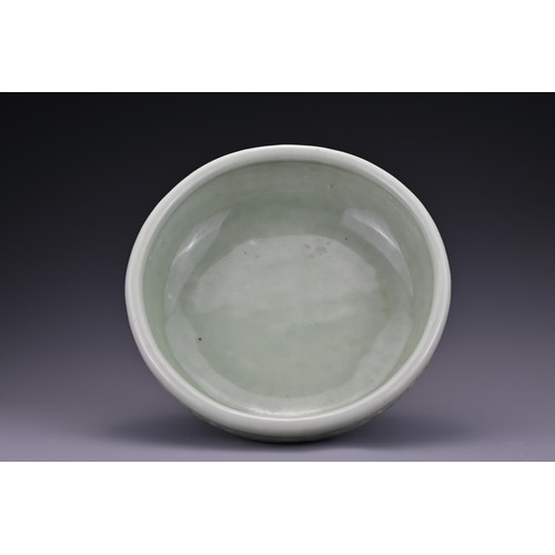 82 - A Chinese 18/19th century carved celadon-glazed porcelain censer. The exterior carved with floral sc... 