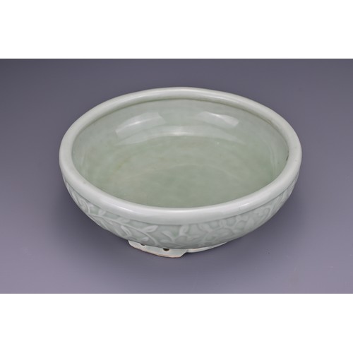 82 - A Chinese 18/19th century carved celadon-glazed porcelain censer. The exterior carved with floral sc... 