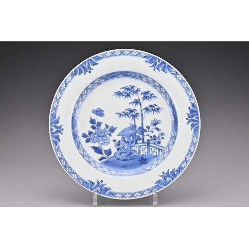 84 - A Chinese 18th century blue and white porcelain dish. Decorated with a garden scene. Diam. 26cm   

... 