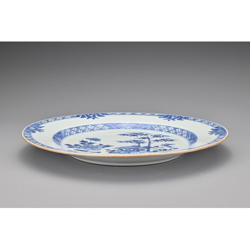 84 - A Chinese 18th century blue and white porcelain dish. Decorated with a garden scene. Diam. 26cm   

... 