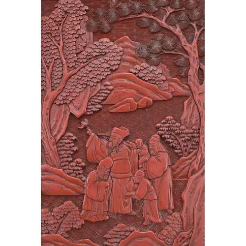 5 - A CHINESE CINNABAR LACQUER PANEL, 19TH CENTURY. Well carved in relief with scholar figures in a land... 