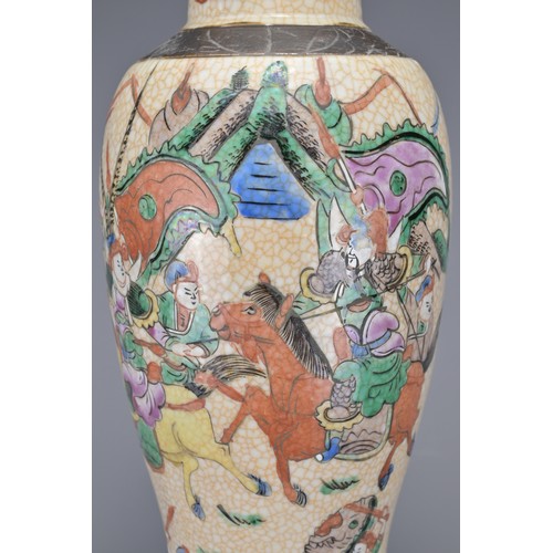 12 - A CHINESE PORCELAIN VASE AND COVER, LATE 19TH CENTURY. The crackle ware vase decorated with polychro... 