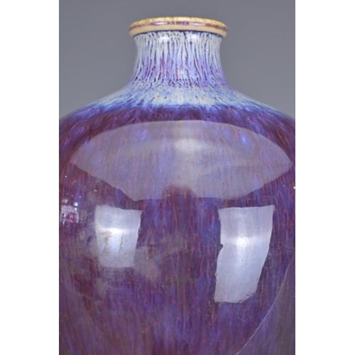 9 - A CHINESE FLAMBE GLAZED MEIPING VASE, 20TH CENTURY. Of typical form covered in a dark purple glaze t... 