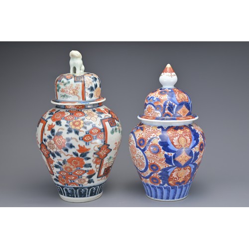 13 - TWO JAPANESE IMARI VASES AND COVERS, 19TH CENTURY. Each of baluster form with floral decoration. 26c... 