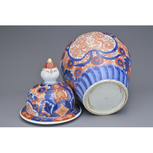 13 - TWO JAPANESE IMARI VASES AND COVERS, 19TH CENTURY. Each of baluster form with floral decoration. 26c... 