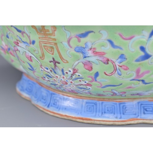 20 - A CHINESE PORCELAIN BOWL, GUANGXU PERIOD. The quarter lobed bowl in lime green ground with famille r... 