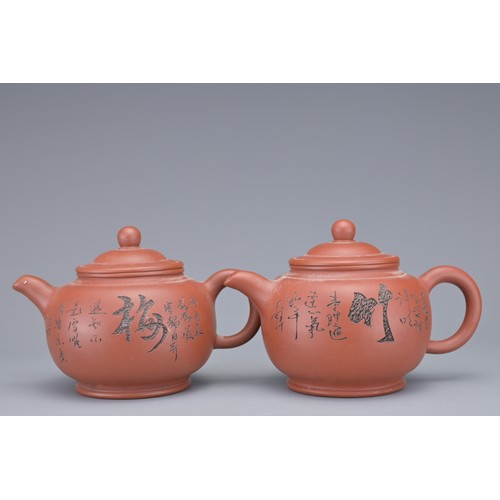 34 - A SET OF FOUR CHINESE YIXING POTTERY TEAPOTS. Each with incised calligraphy and foliage decoration. ... 