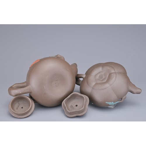 35 - A GROUP OF FOUR CHINESE YIXING POTTERY TEAPOTS. Each in various design. Four darker pottery teapots ... 