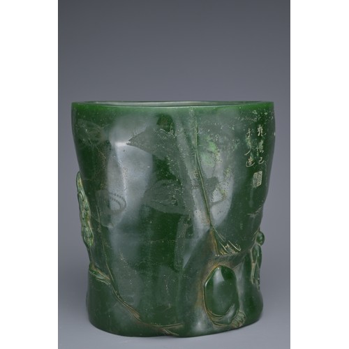 36 - A CHINESE GLASS BRUSH POT. Green colour raised decoration of scholar figures and pine trees with inc... 