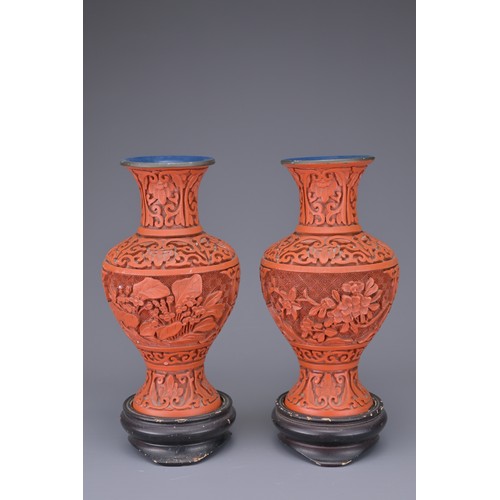 40 - PAIR OF CHINESE LACQUER VASES AND FOO DOGS. A pair of Chinese red lacquer vases carved in relief wit... 