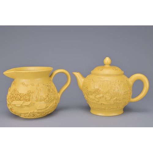 43 - A CHINESE VINTAGE YIXING POTTERY TEA SET, 20TH CENTURY. To include six cups, a teapot and jug in a y... 