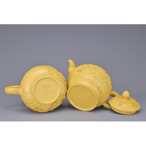 43 - A CHINESE VINTAGE YIXING POTTERY TEA SET, 20TH CENTURY. To include six cups, a teapot and jug in a y... 