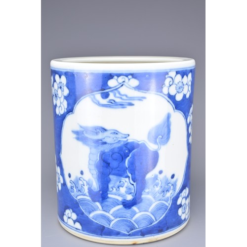 45 - A CHINESE BLUE AND WHITE PORCELAIN BRUSH POT, 19TH CENTURY. With figure of qilin with prunus decorat... 