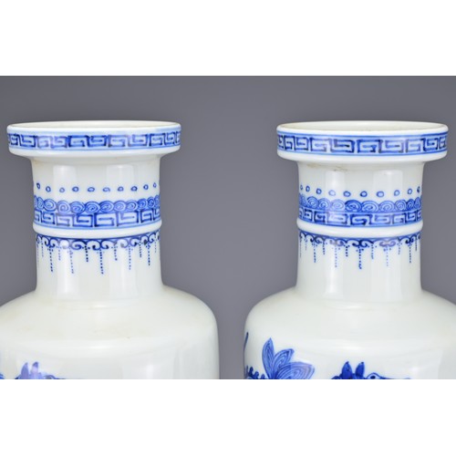 48 - A PAIR OF CHINESE BLUE AND WHITE PORCELAIN ROULEAU FORM VASES, EARLY 20TH CENTURY. Each decorated wi... 