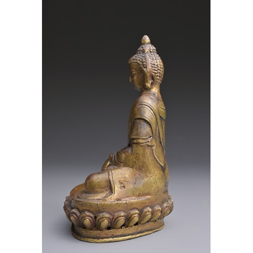 50 - A SINO-TIBETAN BRONZE BUDDHA Hollow cast seated on a lotus with three incised characters to rear abo... 