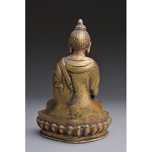 50 - A SINO-TIBETAN BRONZE BUDDHA Hollow cast seated on a lotus with three incised characters to rear abo... 