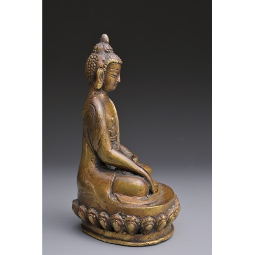 50 - A SINO-TIBETAN BRONZE BUDDHA Hollow cast seated on a lotus with three incised characters to rear abo... 