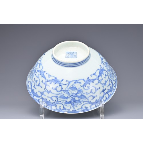 53 - A CHINESE BLUE AND WHITE PORCELAIN BOWL, 19TH CENTURY. Decorated to the exterior with lotus scrolls.... 