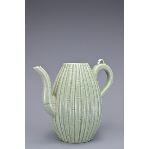 54 - A KOREAN MELON-SHAPED PORCELAIN EWER. With ribbed bamboo design. 18cm height.