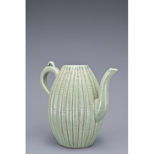 54 - A KOREAN MELON-SHAPED PORCELAIN EWER. With ribbed bamboo design. 18cm height.