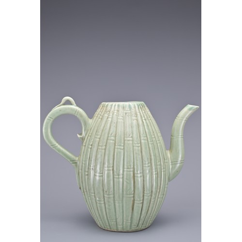 54 - A KOREAN MELON-SHAPED PORCELAIN EWER. With ribbed bamboo design. 18cm height.